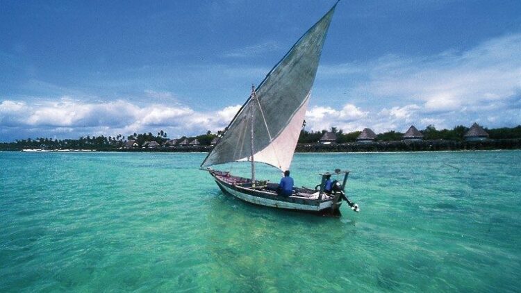 mozambique-dhow-sailing-blue-green-sea__large