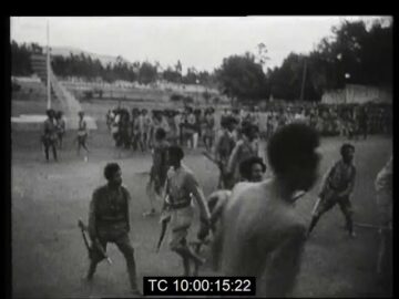 Emperor of Ethiopia Haile Selassie inspects his troops upon his return from exile 26 June 1941