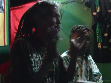 Jamaicas chanting Mau Mau warriors .